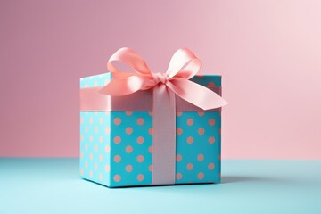 Obraz premium A blue gift box with a pink bow