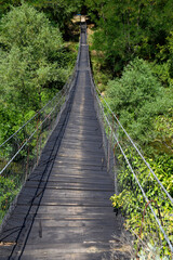 Fototapeta na wymiar Stojan's Bridge wooden suspension bridge in the middle of North Macedonia