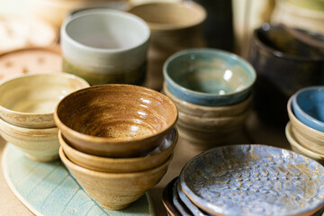 stacks of sets of glazed ceramic bowls