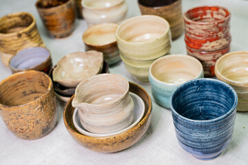 stacks of sets of glazed ceramic bowls