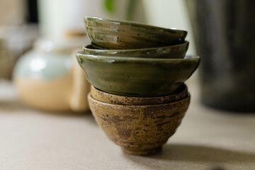 stacks of sets of glazed ceramic bowls
