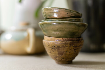 stacks of sets of glazed ceramic bowls