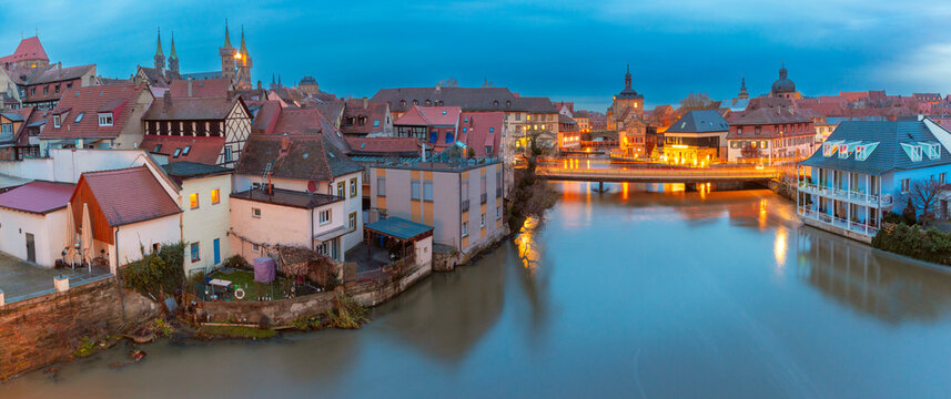 Aerial panoramic view of Old town and Regnitz river at night in Bamberg, Bavaria, Germany