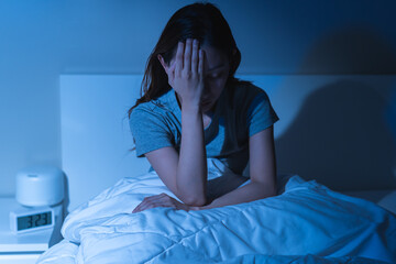 Sad worried and stressed, depressed asian young woman, girl suffering in bed from insomnia problem,...