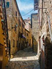 View down a narrow street in Volterra,Italy