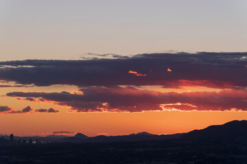 Colorful sunset with silhouettes of mountains