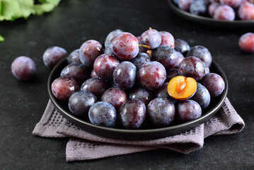 Fresh plums on plate