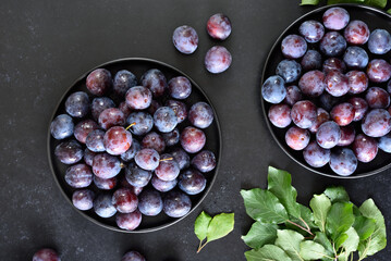 Fresh plums on plate