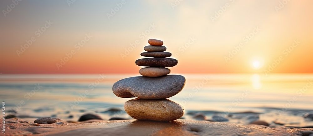 Poster Sunrise beach stones in close up Copy space image Place for adding text or design