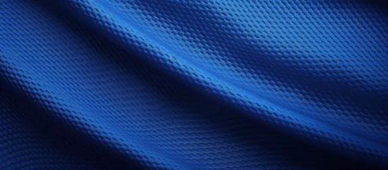 Tuinposter Texture of football jersey fabric in blue with stitched details Copy space image Place for adding text or design © HN Works