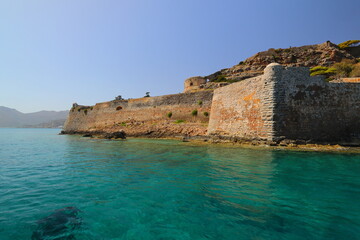 Spinalonga Island on a Beautiful sunny day showing the turqoius sea and blue sky. Crete, Greece, Europe.