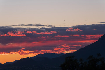 Colorful sunset with silhouettes of mountains