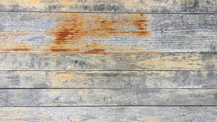 The surface of the wall is made of wooden boards arranged horizontally, the surface of the wood...