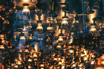 Ceiling light fixture illuminates bright glare in dark room.