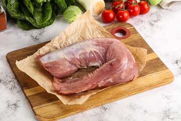 Uncooked raw pork tenderloin with spices