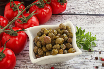 Marinated green capers in the bowl
