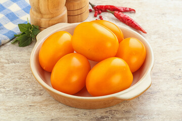 Sweet ripe yellow tomato in the bowl