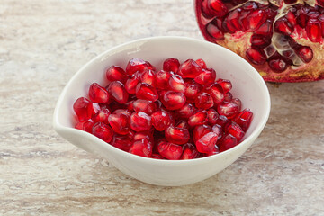 Ripe red Pomegranate seeds in the bowl