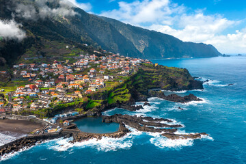 Aerial view of Madeira island. Land meets ocean in Seixal, Madeira, Portugal - obrazy, fototapety, plakaty