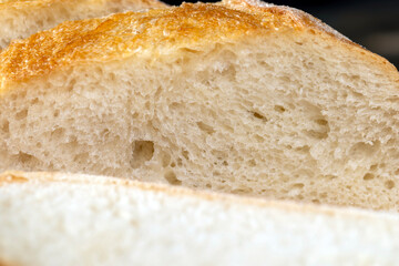 wheat loaf of bread close-up on the table