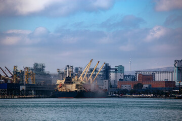 Naklejka premium Commercial port terminal with cargo cranes in Novorossiysk