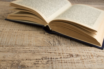 open book on a wooden table. Back to school. Education business concept.