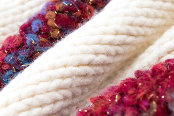 Knitted woolen sweaters. A bunch of knitted winter, autumn clothes, sweaters, knitwear, space for the text.