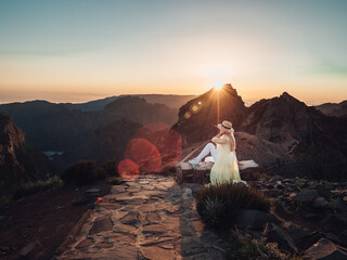 Lost in the rugged beauty of madeira, a fearless traveler basks in the warm embrace of the sun as...