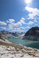 Obraz premium Ala-köl mountain lake with fresh snow during summer in Tian Shan mountains, Karakol, Kyrgyzstan