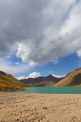 Fototapeta na wymiar Kol Ukok lake surrounded by Tian Shan Mountains in Kochkor, Naryn region, Kyrgyzstan
