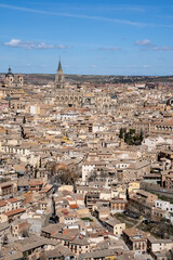 Vertical image of the rooftops of the historic center of Toledo, Spain, with the Cathedral of Santa...