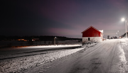 The abandoned barn in winter landscape