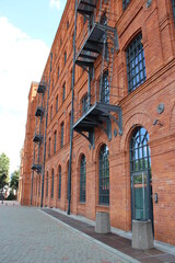 Facade of red brick factory building. Old factory in Lodz