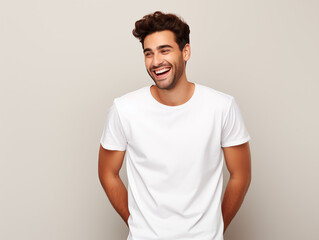 a young male model wearing a blank T shirt for use as mockup with blank beige background