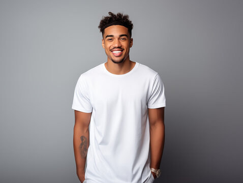 a young male model wearing a blank T shirt for use as mockup with blank background