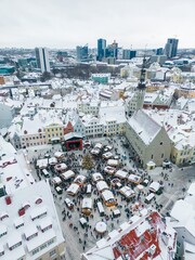 Aerial view of the Christmas market in Tallinn's old town Raekoja Plats, on a cloudy day.