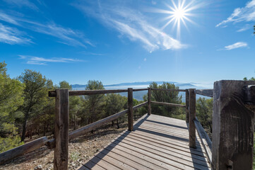 Beautiful landscape from a wooden viewpoint on the road to Moclin (Spain) on a sunny autumn morning