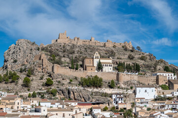 Fototapeta na wymiar View of the fortified enclosure with the Cristo del Paño sanctuary and the remains of the Arab castle in Moclín (Spain)