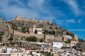 Fototapeta na wymiar View of the fortified enclosure with the Cristo del Paño sanctuary and the remains of the Arab castle in Moclín (Spain)