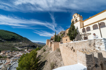 View of the fortified enclosure with the Cristo del Paño sanctuary and the remains of the Arab castle in Moclín (Spain)