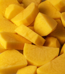 Raw sliced potatoes, top view, close up. 