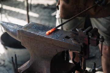 Blacksmith hitting a hot iron