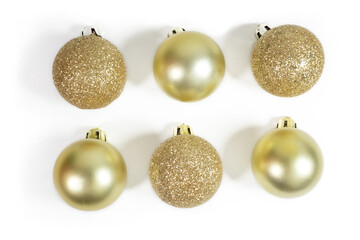 Close up of a set of glitter gold and matte glossy christmas ornament, isolated, top view, flat lay, white background.