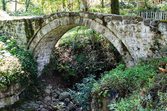 travel to Georgia - Mirveti Arch Bridge (bridge of Queen Tamar in Mirveti) in Adjara on autumn day. The bridge was probably built in the 11th-13th centuries