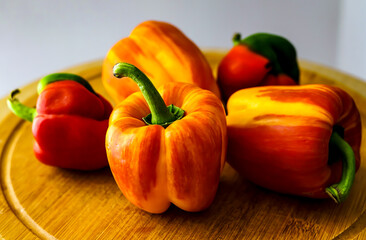 Colorful peppers on the wooden board