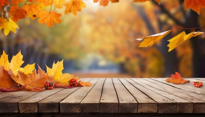 Naklejka na ściany i meble wooden table with orange leaves and blurred autumn background