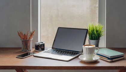 modern workplace with laptop computer coffee cup and office supplies