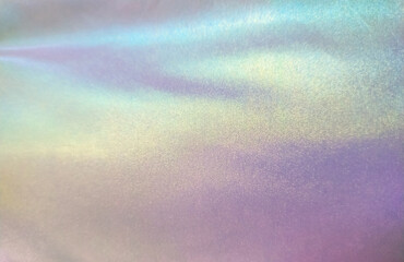 Holographic pastel gradient textile texture background. Outerwear material. Fashion trend.	