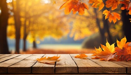 wooden table with orange leaves and blurred autumn background