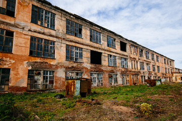 Fototapeta na wymiar Old abandoned industrial building waiting for demolition